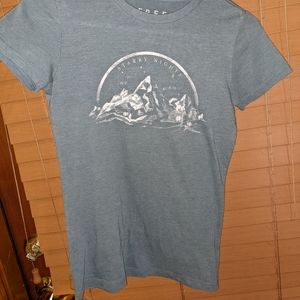 Blue, size small t shirt, with mountain design.
